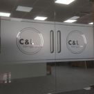 a set of glass doors with logo manifestation